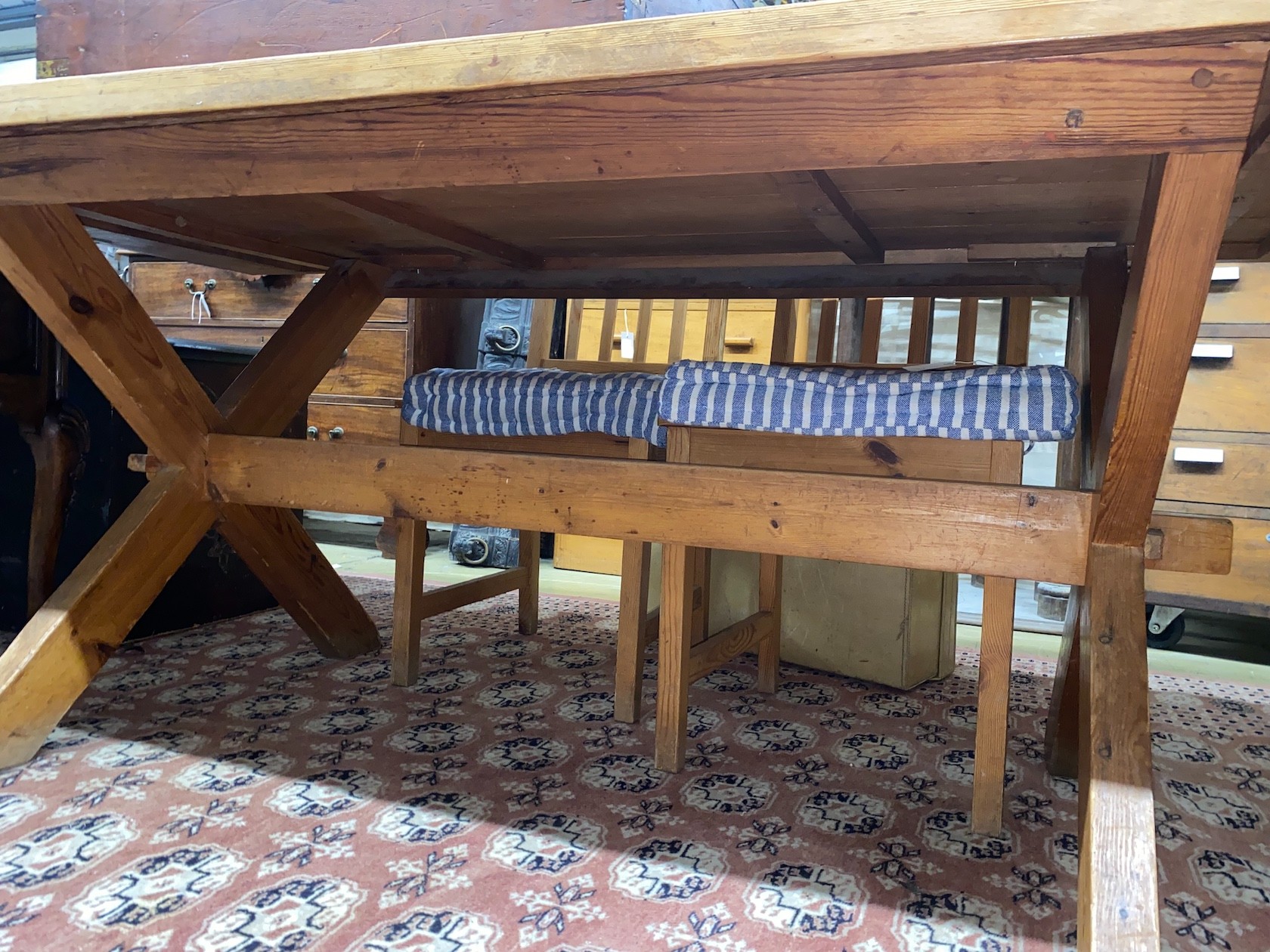 A rectangular pitch pine tavern type refectory dining table, length 182cm, width 86cm, height 73cm and four pitch pine dining chairs